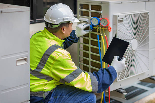 Professional Air Duct Cleaning technician working in Hollis, NY
